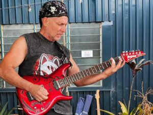 Sean Mullen with Satriani guitar